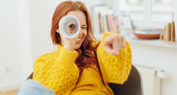 Playful young woman playing I Spy