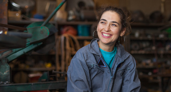 woman, young, mechanic, workshop, sitting, smile, worker, tomboy, happy, overalls, blue, indoors, background, dirt, dirty, face, tools, posing, satisfied, tough, thinking, female, repair, shop, adult, caucasian, industry, service, garage, work, technician, occupation, looking, girl, person, machinery, professional, equipment, apprentice, trainee, profession, workplace, smiling, blurred, brunette, beautiful